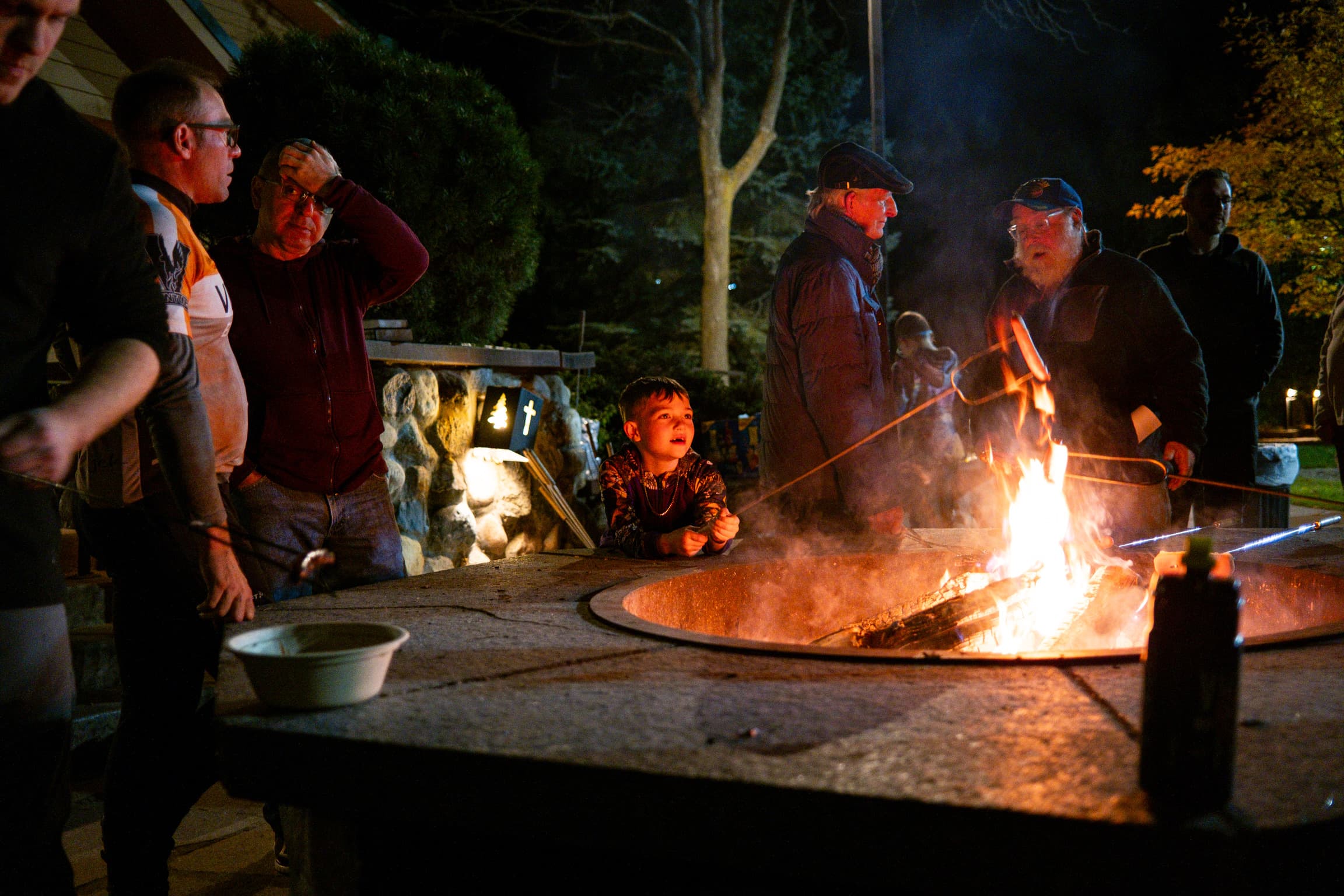 Friends gathered around the campfire