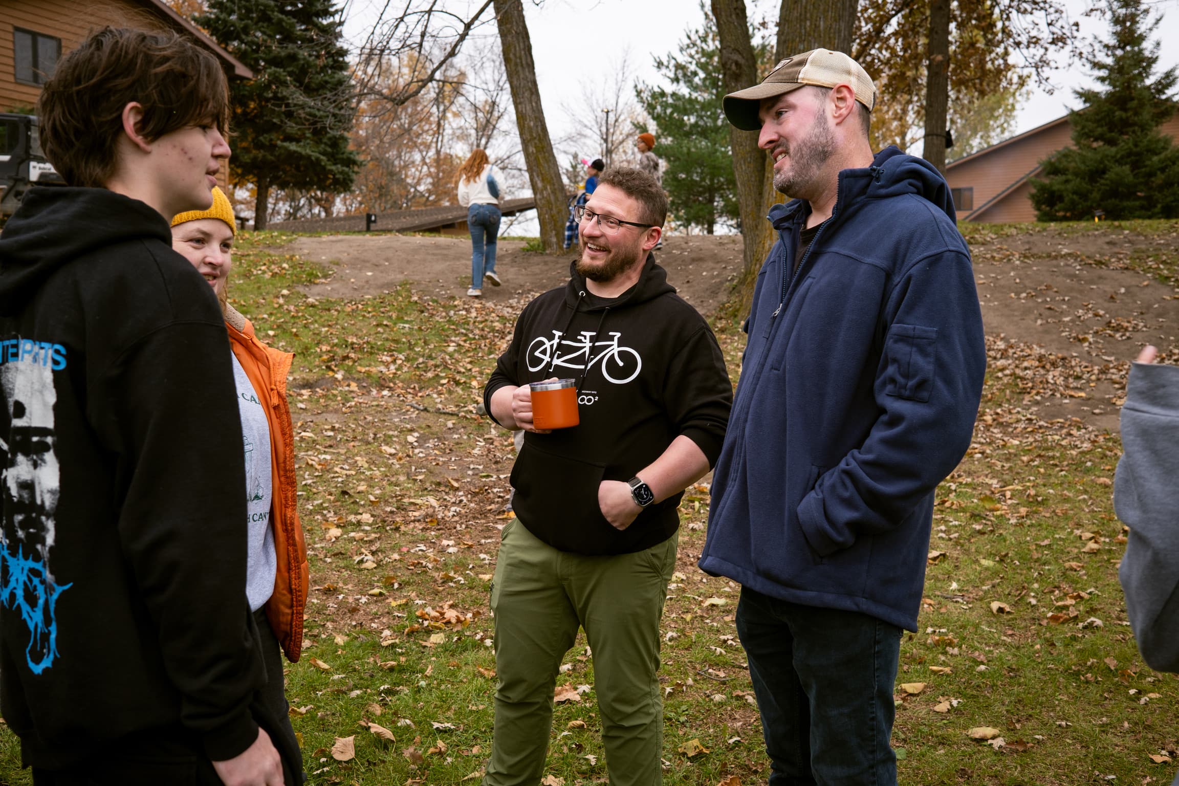 Friends talking outside at fall retreat