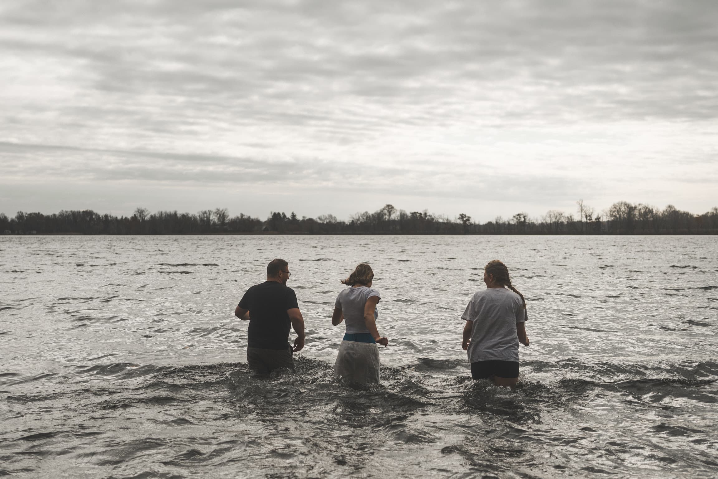 Friends from Corner Church standing together in Cedar Lake